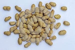 organic peanuts in shell, isolated on white background.
