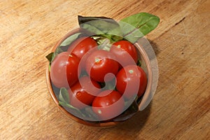organic plum tomato with salad in a bowl