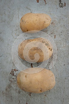 Organic potatoes on a wooden board