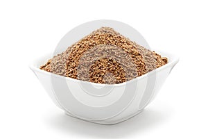 Organic powder of Indian Jujube (Ziziphus mauritiana) in a white ceramic bowl.