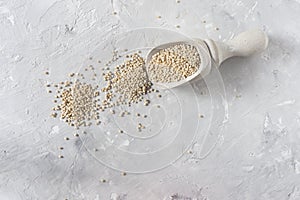 Organic quinua cereal in color bowl on white background