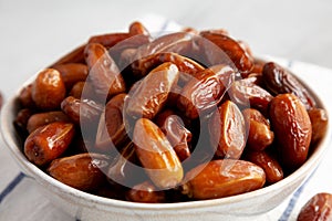 Organic Raw Date Fruit in a Bowl, side view. Close-up
