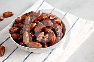 Organic Raw Date Fruit in a Bowl, side view. Copy space