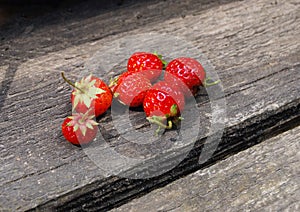 organic ripe strawberries on vintage board