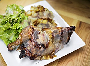 Organic roast rotisserie chicken with potatoes and salad meal