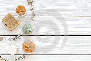 Natural herbal cosmetics on white wooden background top view space for text