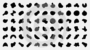 Organic shapes. Black abstract irregular oval and round spots. Pebble silhouettes and fluid splodge. Isolated graphic