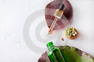 Organic Spa Cosmetic With Herbal Ingredients. Vegetable serum for skin with herbal extracts. glass bottle with a pipette