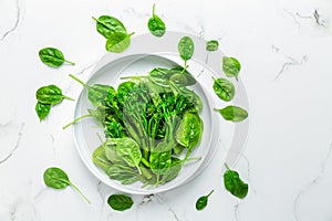Organic spinach with broccolini bimi in bowl on white background photo