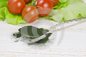 Organic spirulina algae powder in spoon