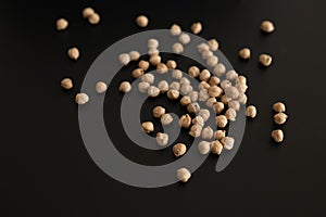 Organic sprouted chickpeas. heap of dried chickpeas on black background