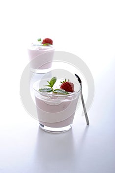 Organic strawberry in natural yogurt and mint