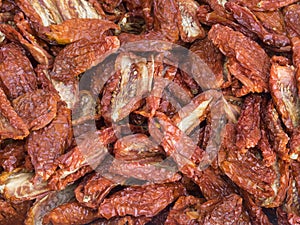 Organic sun dried red tomatoes displayed for sale in a country fair