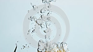 Organic tomatoes dropping water closeup. Colorful summer vegetables splashing