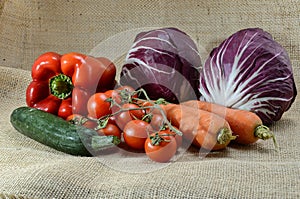 Organic vegetable composition: red pepper, salad, carrots, tomato and courgette