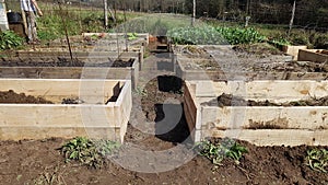 organic vegetable garden. Raised wooden beds to grow vegetables at home. Making a new vegetable garden