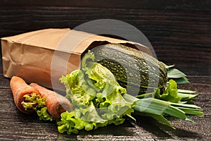 Organic vegetables. bag of products on a dark wooden background