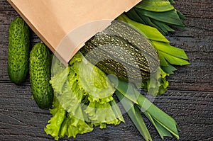 Organic vegetables. bag of products on a dark wooden background