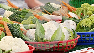 Organic vegetables on counter, fresh local produce homegrown on stall. Farmers food market in USA.