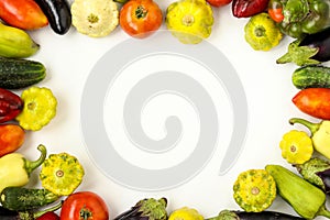 Organic Vegetables Frame: tomatoes, patissons, peppers, cucumbers and eggplant on white background, Organic food concept,