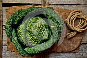 Organic vegetables : green cabbage on a wooden board photo