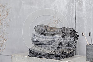 Organic waffle linen towels, bamboo toothbrushes, bathroom zero waste accessories in grey shades