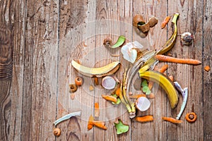 Organic waste on a wooden background . Top view. Save the Earth separate sorting of garbage. Ecology concept.