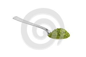 Organic wheatgrass powder in steel tea spoon isolated on white. Detox superfood