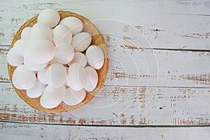 Organic white chicken eggs in basket