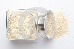 Organic White  Sesame seedsSesamum indicum polished or white Til without shell in a glass jar with Lid, photo