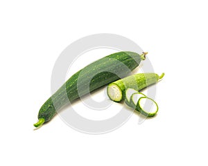 Organic whole luffa fruit with half cuts and slices isolated on white background
