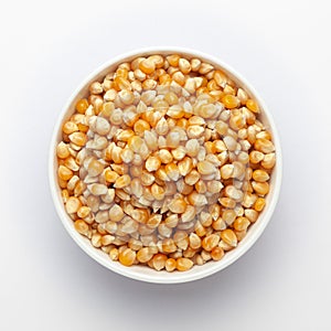 Organic yellow corn seed or maize Zea mays in white ceramic seed. T photo