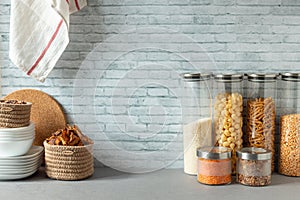 Organising zero waste storage in kitchen. Pasta and cereals in reusable glass containers in kitchen