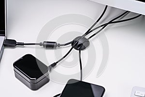 Organized Cable Holder On Table With Charging Cables