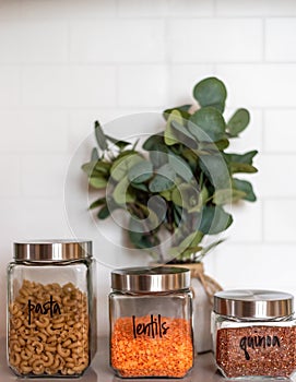 Organized kitchen pantry with labeled canisters