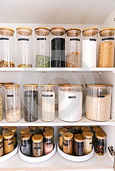 Organized labeled food pantry in a home kitchen with spices