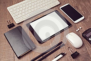 Organized office objects on table. Digital tablet mock up