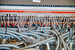 Organized tidy and not messy electronic signal processing wires in a science lab. Many connected cables in sockets