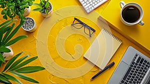 Organized Workspace with Laptop, Notebook, Glasses, Coffee, Plants, and Keyboard on Vibrant Yellow Background for Productivity and