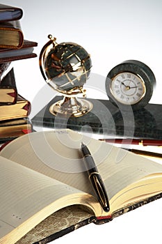 Organizer, pen, books