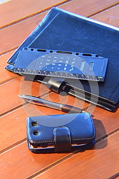 Organizer, pen and mobile phone