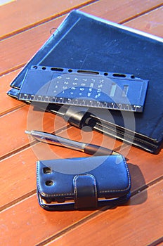 Organizer, pen and mobile phone