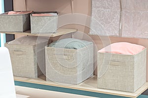 Organizing home storage. Organization of home space. Storage of things in the dressing room on the shelves in textile
