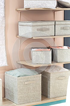 Organizing home storage. Organization of home space. Storage of things in the dressing room on the shelves in textile