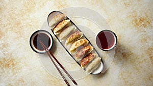 Orginal asian dumplings gyoza served in long plate