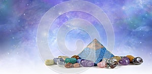 Orgone Pyramid surrounded by amplifying healing crystals