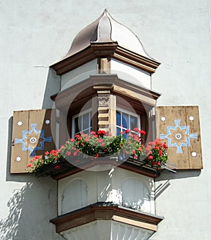 Oriel window with flower boxes photo