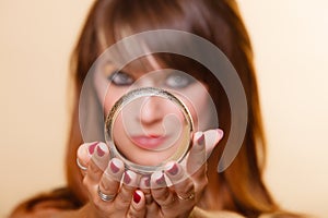 Orient girl with makeup showing armlet