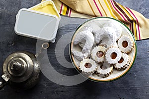 Oriental Algerian sweet cookies kaab el ghazal translated in gazelle horns name and cookies with apricot jam. photo