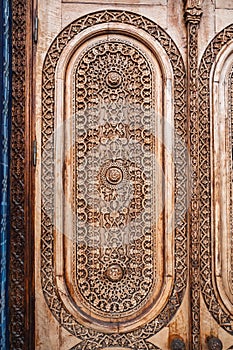 oriental arab pattern Uzbek traditional ornament on wooden carved door in Tashkent in Uzbekistan closeup